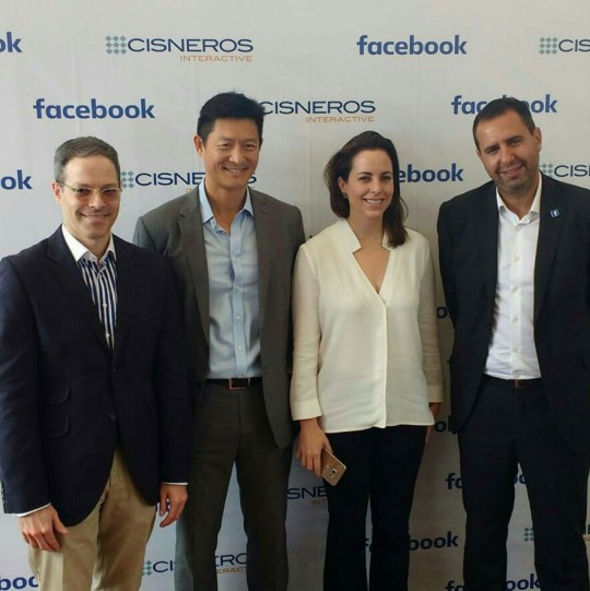 TEAM PHOTO IN FRONT OF FACEBOOK SIGN AND THE VENEZUELA LAUNCH